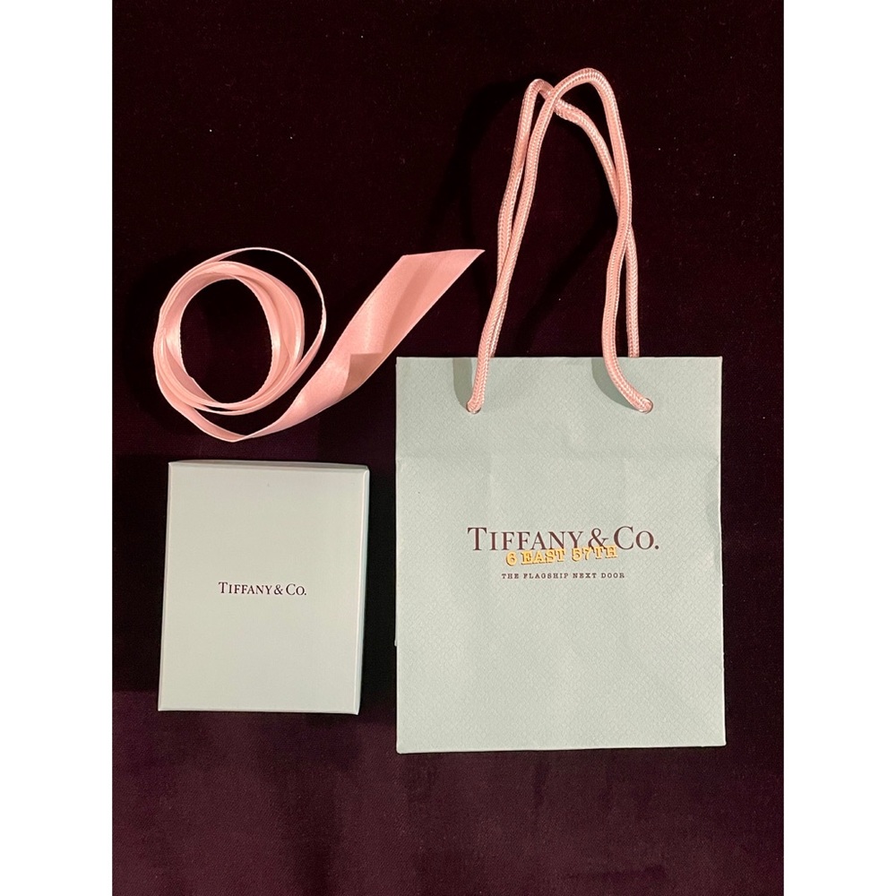 Tiffany & Co. 3 items: small bag + box in blue + white ribbon. Empty. Authentic.